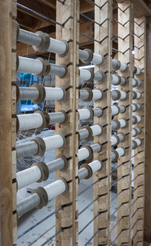 Warping fibers on spools.