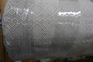A finished bolt of woven fabric.