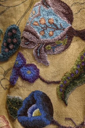 Alma Duseault hooking a rug started by Jeannie Zook