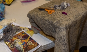 Nancy Taylor gets ready to hook a rug about owls