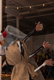 Who is this joyful dancer in the insect outfit?