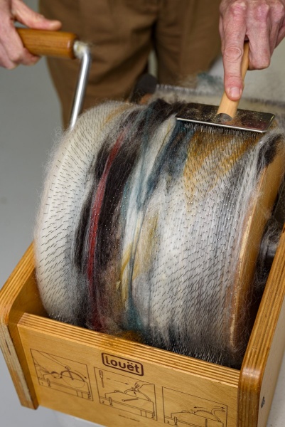 Carded wool on the drum card.