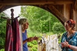 Guest artist Lynn Sternfels displayed scarves and chatted with v