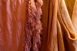 Shawls, blouses and linen jackets all naturally-dyed by the artist.