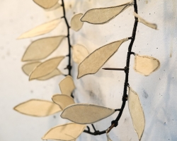 Detail of a piece in progress on her wall.