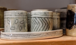 She throws small cups and pots as studies for larger work.
