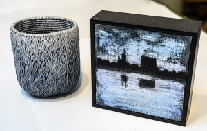 Coiled basketry and a painting.
