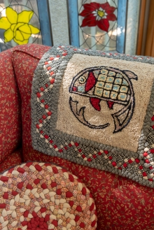 Nancy and her husband worked on this hooked/braided piece that graces the chair.