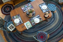 Another beautiful braided rug under the kitchen table.