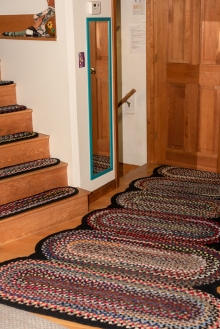 Nancy custom designed and braided these concentric oval rugs to fit her hallway.