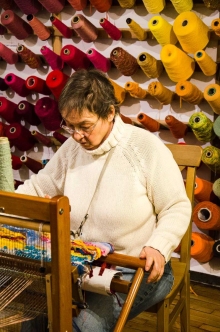 At least eight weavers fill the small