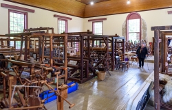 The former church is filled with spinning wheels and looms.