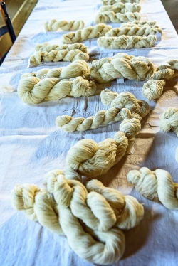 Final skeins of yarn will be woven into blankets at the school t