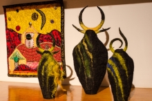 three vessels and a quilt from another artist