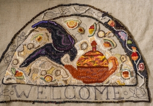 Tori Lambert's "Welcome" mat with crow and teapot.