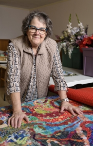 Donna Hezlep, teacher, hooker, quilter and ambassador of fun,  stands by her work.