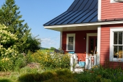 The house is surrounded by perennial gardens designed and planted by Judith.