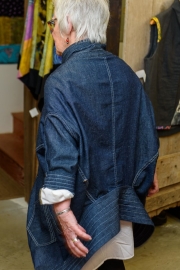 The collar at the base can be flipped and worn at the neck.