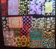Painted fabric hanging on a stairwell.