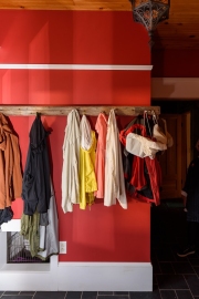 The mud room is red in order to echo the earth -to-home traverse.