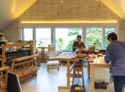 Two weavers prepare for the day.