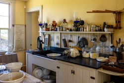 The kitchen with appliances and tools of the  day.